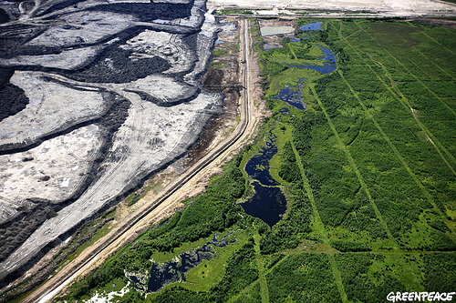 Aerial view of seismic lines and a tarsands mine in the Boreal forest north of Fort McMurray, northern Alberta, Canada. © Jiri Rezac / GREENPEACE