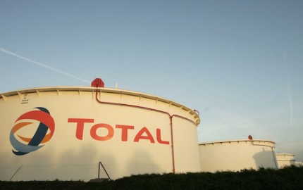 ANTWERP, BELGIUM - NOVEMBER 23:  Gas containers featuring the Total corporate logo at the Total Refinery on November 23, 2006 in Antwerp, Belgium. Total Refinery Antwerp, the second largest refinery in Europe, is the largest and most complex refinery within the Total Group. Products are exported by sea-going vessels, trucks and pipelines from its location in the Port of Antwerp.  (Photo by Mark Renders/Getty Images)